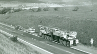 Importation of the new Demag TC 1200 crane to Czechoslovakia over the Rozvadov frontier crossing directly to the first construction site of the Čížkovice cement plant (1974)